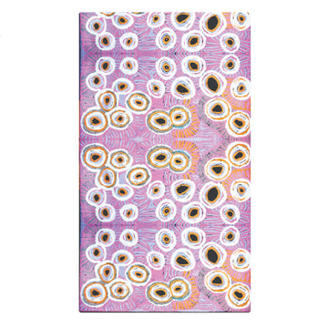 A sarong is lying flat and printed with artwork by Murdie Morris in purple.