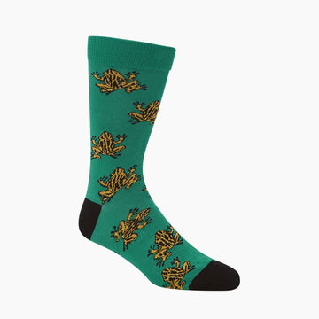 A green sock with a black toe and heel printed with yellow corroboree frogs.