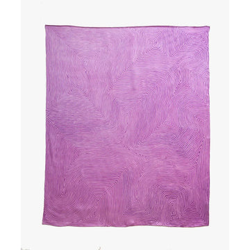 A pink silk scarf is laying flat and printed with a swirl pattern in artwork by George Tjungurrayi.