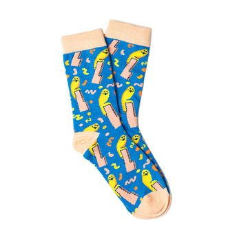 A pair of blue socks with light brown orange heels, toes and cuffs. The socks are printed with a yellow owl statue.