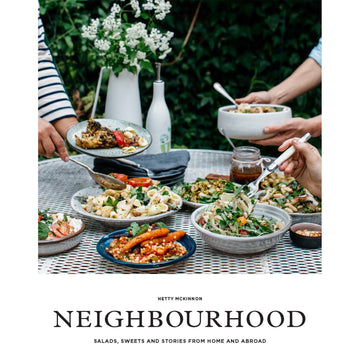 'Neighbourhood' book cover featuring a photo of plates of food on a table and hands serving the food.