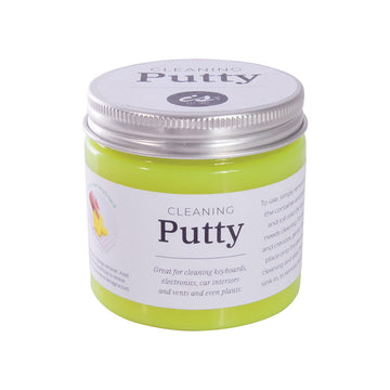 A clear jar filled with fluoro yellow cleaning putty. There isa  product label across the jar with information.