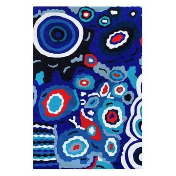 Hand woven woollen rug, 2ftx 3ft, original artwork created by Andrea Adamson Tiger. Bright, colourful symbols, concentric circles. Colours various shades of blue, red, black, white. Seven Sisters story.