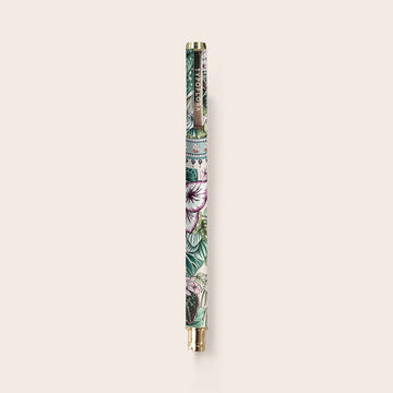 A pen printed with plants with a gold handle and tip.