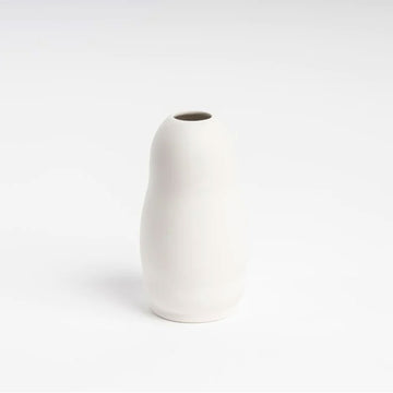 A small ceramic vase in white with a rounded shape.