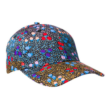 A cap is sitting on a angle and is printed with artwork by Charlene Marshall.