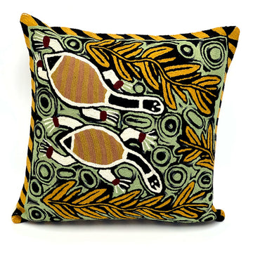 A chain stitched cushion featuring two long neck turtles in artwork by Virginia Gallarla.