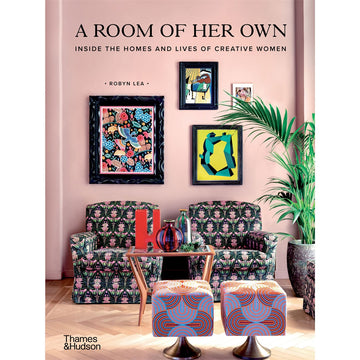 'A Room of Her Own' book cover featuring a photo of two printed arm chairs with a table in front of them with glass vases. In front of the table are two printed ottomans and there are four framed pictures on the wall behind the arm chairs.