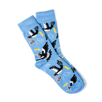 A pair of blue socks printed with magpies and clouds.