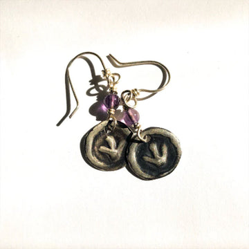 A pair of drop earrings with a amethyst stone linked to a circle with an emu footprint embossed.