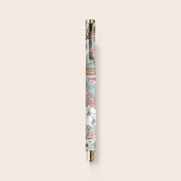 A pen printed with flowers with a gold handle and tip.