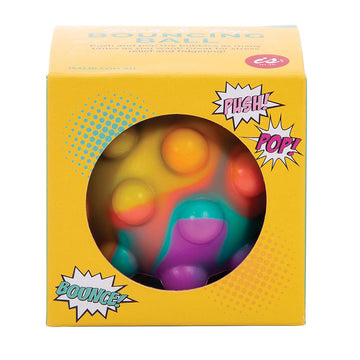 A ball inside a yellow cube with a hole cut out on the front. The ball has smaller circles on top of it to 'pop'.