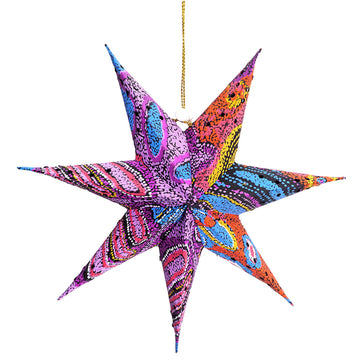 A 3D paper star with seven points and printed with artwork by Andrea Adamson.
