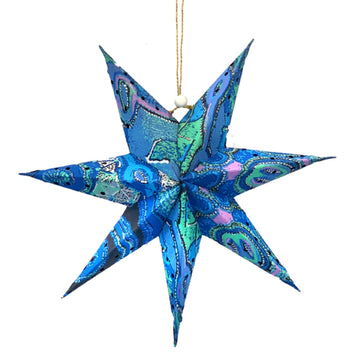 A 3D paper star with seven points and printed with artwork by Theo Hudson.