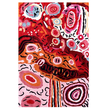 Hand woven woollen rug, 2ftx 3ft, original artwork created by Andrea Adamson Tiger. Bright, colourful symbols, concentric circle. Colours red, pink, white, orange, blue, black. Depicts the Seven Sisters story.