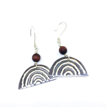 A pair of sterling silver drop earrings with a tigers eye bead linked to a semi circle with embossed arches.