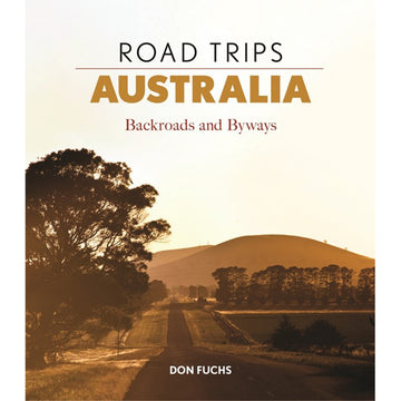 'Road Trips Australia Backroads and Byways' book cover featuring a photo of a road surrounded by trees and land with a brown filter on the photo.