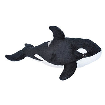 A soft toy in the shape of a black and white orca whale.