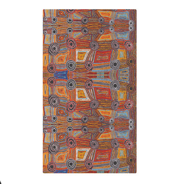 A sarong printed with artwork by Mary Napangardi Brown is laid out flat.