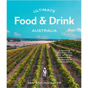 'Ultimate Food & Drink Australia' book cover featuring a photo of a woman walking through a winery field.