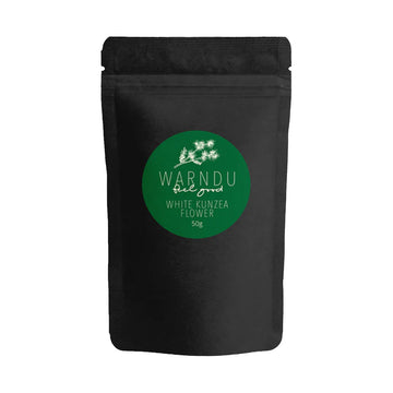 A black packet with a round green label on the front with the text 'Warndu Feel Good White Kunzea Flower'.