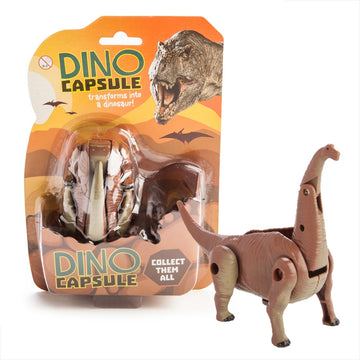 A dinosaur toy standing next to its packaging titled 'Dino Capsule'.