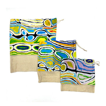  Three different size produce bags with a hessian strip on the bottom third and a cotton print by Judy Watson on the top two thirds.