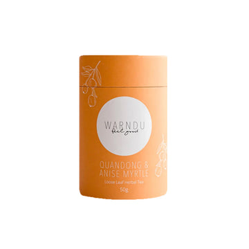 An orange canister with a white round label on the front with the text 'Warndu Feel Good Quandong & Anise Myrtle'.