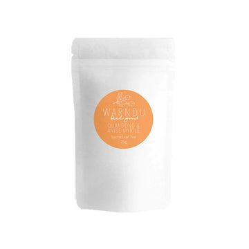 A white packet with a round orange label with the text 'Warndu Feel Good Quandong & Anise Myrtle Loose Leaf Tea'.