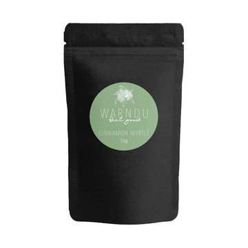 A black packet with a green round label on the front with the text 'Warndu Feel Good Cinnamon Myrtle'.