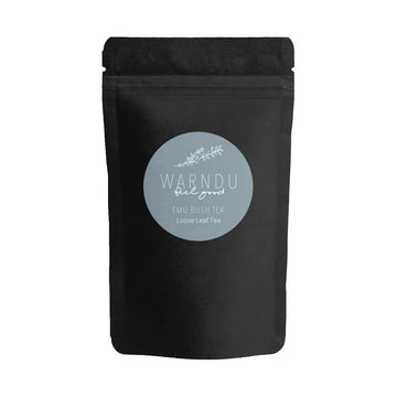 A black packet with a grey blue round label on the front with the text 'Warndu Feel Good Emu Bush Tea'.