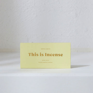 A rectangle box in yellow with 'This is Incense' written in gold on the front.