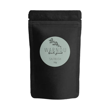 A black packet with a blue grey round label on the front with the text 'Warndu Feel Good Saltbush'.
