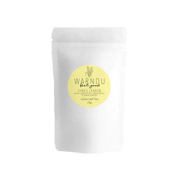 A white packet with a round yellow label in the middle with the text 'Warndu Feel Good Three Lemon'.