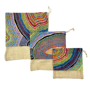 Three different sized produce bags printed with artwork by Liddy Walker on the top two thirds of the bag.