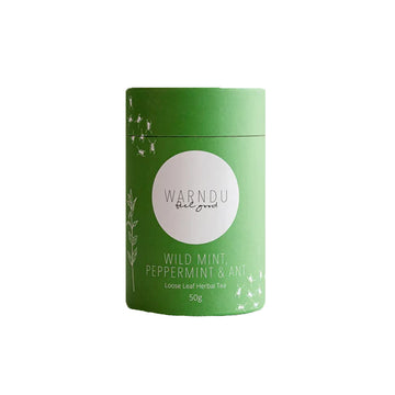 A green canister with a round white label on the front with the text 'Warndu Feel Good Wild Mint, Peppermint and Ant'.