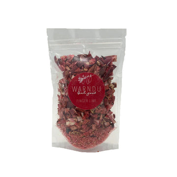 A clear bag filled with freeze dried finger lime chips with a red round label on the front with the text 'Warndu Finger Lime'.