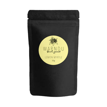 A black packet with a round yellow label on the front with the text 'Warndu Feel Good Lemon Myrtle'.