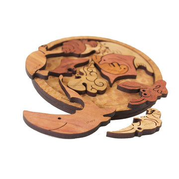 A round puzzle with different marine animals as each puzzle piece. The animals include a octopus, hermit crab and dolphin.