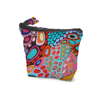 A cosmetic bag with a zip along the top and printed with artwork by Amanda Jane and Dorothy Gabori.
