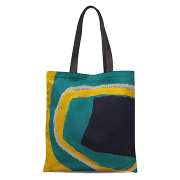 A tote bag with black handles printed with artwork in green, yellow, black and white.