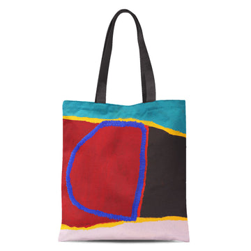 A tote bag with black handles printed with artwork in green, black, red and blue.