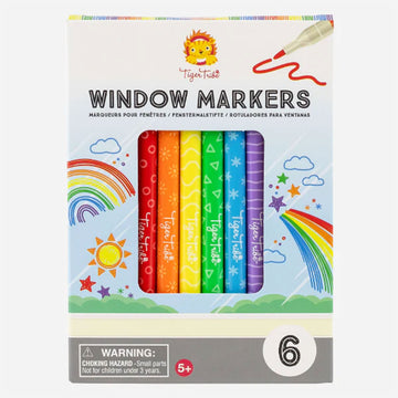'Window Markers' box cover with the title at the top and a rectangle cut out showing the coloured markers inside. There are illustrations of rainbows, stars and clouds on the box.