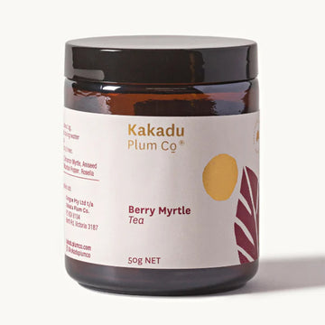 A glass jar with a wide product label that says 'Kakadu Plum Co Berry Myrtle Tea 50g'.