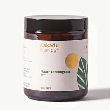 A glass jar with a wide product label which says 'Kakadu Plum Co Maarr Lemongrass Tea 20g'.