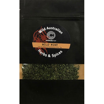 A black packet with the name 'Wild Australian Herbs & Spices Wild Mint'. There is a small cut out in the bag showing the mint leaves inside.