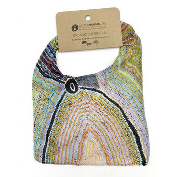 A baby bib printed with artwork by Liddy Walker attached to a brown information card.