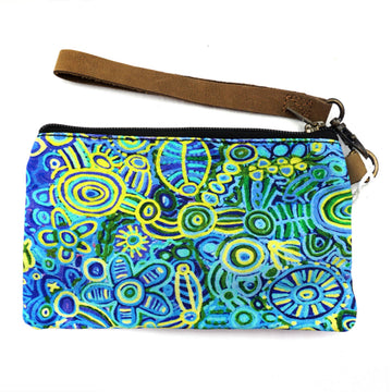 A zippered pouch with a brown wrist strap. The pouch features artwork by Cedric Varcoe in blue and yellow.