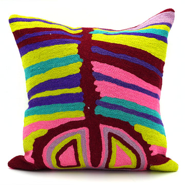 A cushion made from chainstitched wool printed with artwork by Judy Watson.
