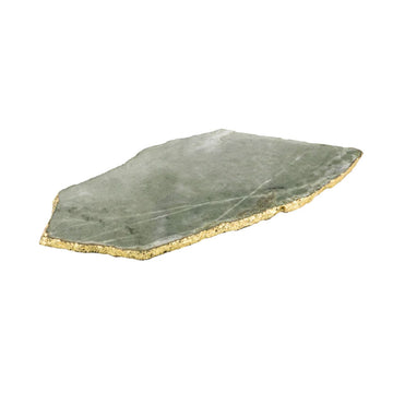 A flat irregular triangle shape of green agate with a gold rim.